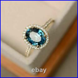 2.5Ct Oval Cut London Blue Topaz Halo Engagement Ring In 14K Yellow Gold Finish
