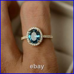 2.5Ct Oval Cut London Blue Topaz Halo Engagement Ring In 14K Yellow Gold Finish