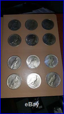 DANSCO ALBUM COMPLETE SET OF AU PEACE DOLLARS 1921-1935. All mintmarks 24 coins
